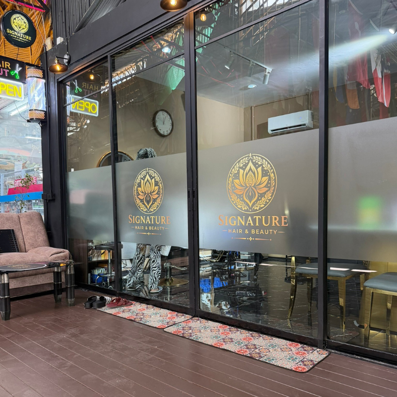 Signature Hair & Beauty storefront with OPEN sign and tiled entrance